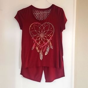 Wine color No Boundaries shirt with lace detailing on the back.